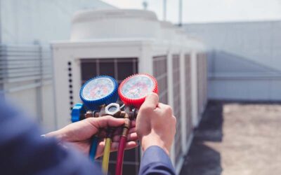 Technician is checking air conditioner ,measuring equipment for filling air conditioners.