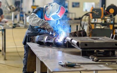 mechanical metal worker in workshop with professional cutting and welding tools